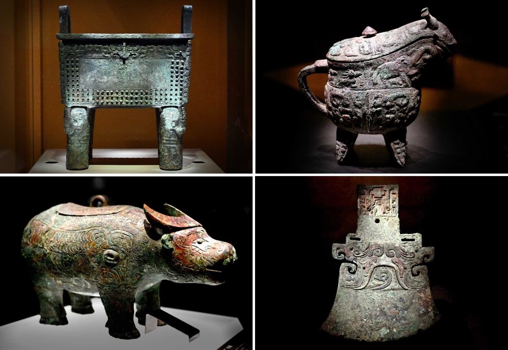 這是殷墟博物館新館內(nèi)展出的“司母辛”銅鼎（左上）、“亞長”銅觥（右上）、“亞長”牛尊（左下）、“亞長”銅鉞（拼版照片，2月23日攝）。